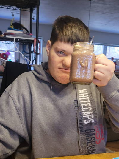 A One Day Niche participant hoists a mug of hot chocolate